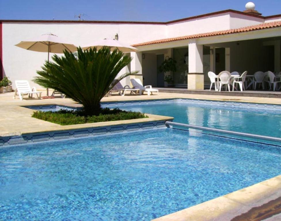 San Juan Park Hotel San Juan del Rio Exterior photo A swimming pool